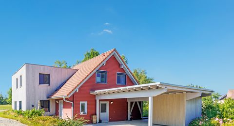 Anbau Holzhaus rote Fassade Wohnraumerweiterung